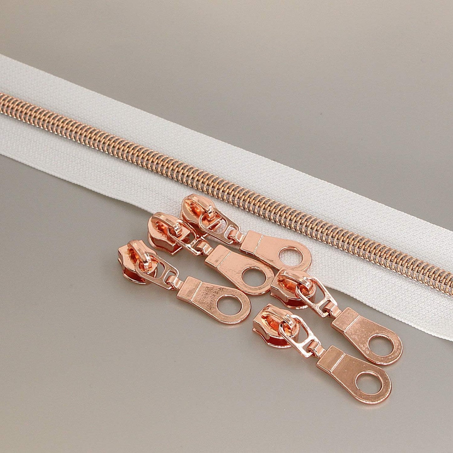 Leekayer #5 Rose Gold Metallic Nylon Coil Zippers by The Yard Bulk 10 Yards White Tape with 25pcs Rose Gold Sliders for DIY Sewing Tailor Craft Bag(White)