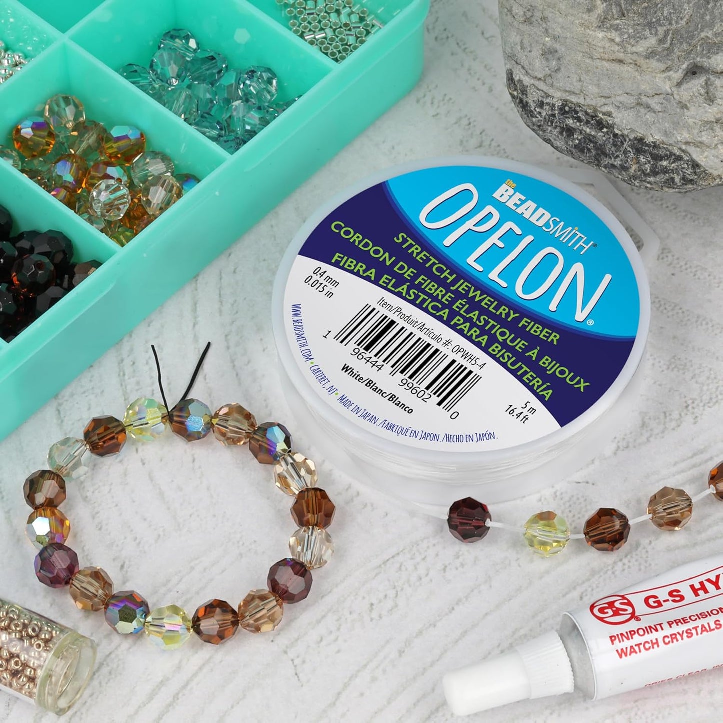 The Beadsmith Opelon Stretch Cord – Elastic Beading Fiber, White, 0.4 mm Diameter, 5 Meters (16.4 ft) Spool