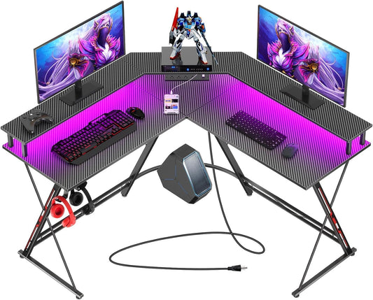 SEVEN WARRIOR L Shaped Gaming Desk with LED Lights & Power Outlets, 50.4” Computer Desk with Monitor Stand, Corner Desk with Carbon Fiber Surface, Gaming Table with Hooks, Black